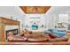 Expansive living room with hardwood floors, fireplace, built-ins, and seamless access to the kitchen at 2621 Stearns Rd, Valrico, FL 33596