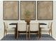 Stylish dining room setup with minimalist art and a dark table, creating an elegant eating space at 3473 Lapis Lake Dr, Zephyrhills, FL 33541