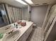 Bathroom featuring a vanity, neutral finishes, and great lighting at 3835 Sailmaker Ln # X, Holiday, FL 34691