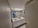 Well-lit bathroom featuring a vanity with ample counter space and neutral finishes at 3835 Sailmaker Ln # X, Holiday, FL 34691