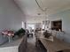 Inviting dining room with view into the living room, great for entertaining at 3835 Sailmaker Ln # X, Holiday, FL 34691