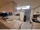 Functional kitchen features light countertops, plenty of cabinetry, and modern appliances, ideal for everyday cooking and entertaining at 3835 Sailmaker Ln # X, Holiday, FL 34691