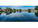 Picturesque pond view showcasing water fountain feature and lush greenery in a serene community setting at 3835 Sailmaker Ln # X, Holiday, FL 34691