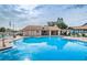 Resort-style pool and lounging area perfect for relaxation and community gatherings at 3835 Sailmaker Ln # X, Holiday, FL 34691