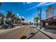 Charming street view of Tarpon Springs with vibrant shops and a lighthouse under a clear blue sky at 3835 Sailmaker Ln # X, Holiday, FL 34691