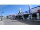 Charming street view featuring the popular Hellas Restaurant with unique architecture under a blue sky at 3835 Sailmaker Ln # X, Holiday, FL 34691