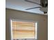 Bedroom with natural light from two windows, awaiting renovation with damaged floor at 3925 W Eden Roc Cir, Tampa, FL 33634