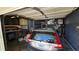 Garage features a car, storage, and mechanical equipment, offering parking and utility space at 3925 W Eden Roc Cir, Tampa, FL 33634