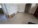 Open-concept living room undergoing renovations, with view into adjoining room at 3925 W Eden Roc Cir, Tampa, FL 33634