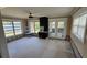 Open living room with multiple windows, allowing natural light to fill the space at 3925 W Eden Roc Cir, Tampa, FL 33634