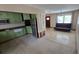 Open floor plan with kitchen, dining, and living area; perfect for modern living and entertaining at 3925 W Eden Roc Cir, Tampa, FL 33634