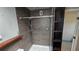 Updated shower features a rainfall shower head, tiled surround, and built-in shelving at 3925 W Eden Roc Cir, Tampa, FL 33634