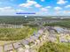 Aerial view of the neighborhood homes surrounded by lush landscaping near community amenities at 4166 Epic Cv, Land O Lakes, FL 34638