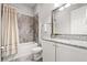 Full bathroom with decorative shower curtain, granite vanity, and tiled flooring at 4166 Epic Cv, Land O Lakes, FL 34638