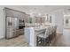 Contemporary kitchen with stainless appliances, gray cabinetry, granite countertops, and a convenient center island at 4166 Epic Cv, Land O Lakes, FL 34638
