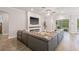 Living room with a fireplace, TV, and sliding glass doors leading to the outdoor patio at 4166 Epic Cv, Land O Lakes, FL 34638