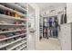 Spacious walk-in closet boasts custom shelving, drawers, and organization system at 4166 Epic Cv, Land O Lakes, FL 34638