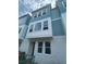 New construction townhome showcases a light blue exterior, white trim, and energy-efficient windows at 479 31St N Way, St Petersburg, FL 33713