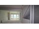 Spacious living room area ready for customization with a large window and attached living space at 479 31St N Way, St Petersburg, FL 33713