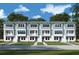 Charming townhouse boasts a modern facade, complemented by a well-manicured lawn and inviting entryway at 479 31St N Way, St Petersburg, FL 33713