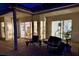 Enclosed patio with tile floors and views of the interior and garden at 5001 Queen Palm Ne Ter, St Petersburg, FL 33701