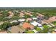 Scenic aerial view of a suburban neighborhood featuring lush landscaping and a variety of roof styles at 5001 Queen Palm Ne Ter, St Petersburg, FL 33703