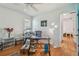 Bedroom featuring wood floors, a ceiling fan and a desk at 5001 Queen Palm Ne Ter, St Petersburg, FL 33703