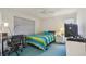 Cozy bedroom featuring a ceiling fan and a window with blinds at 5001 Queen Palm Ne Ter, St Petersburg, FL 33703