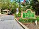 A welcoming entrance to Placido Bayou, a gated community with lush landscaping and a security guardhouse at 5001 Queen Palm Ne Ter, St Petersburg, FL 33703
