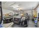 Attached two-car garage showcasing two black vehicles, storage shelves, and a garage door at 5001 Queen Palm Ne Ter, St Petersburg, FL 33703