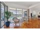 Sitting area with pool views, hardwood floors, and a table setting at 5001 Queen Palm Ne Ter, St Petersburg, FL 33703