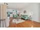 Spacious living room with bright walls, wood floors, and a view into other rooms at 5001 Queen Palm Ne Ter, St Petersburg, FL 33703