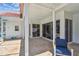Covered patio with brick flooring, screened-in pool area, and comfortable seating at 5001 Queen Palm Ne Ter, St Petersburg, FL 33703