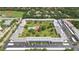 Aerial view of the community, showcasing lush landscaping, ample parking, and a sparkling pool at 5095 Bay Ne St # 210, St Petersburg, FL 33703