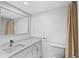 Bathroom featuring modern fixtures, bright lighting, and a large mirror at 5095 Bay Ne St # 210, St Petersburg, FL 33703