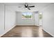 This bedroom is bright, airy, and features hardwood floors and a modern ceiling fan at 5095 Bay Ne St # 210, St Petersburg, FL 33703