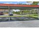 Reserved covered parking spaces for residents and guests near well-maintained landscaping at 5095 Bay Ne St # 210, St Petersburg, FL 33703