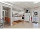 The kitchen features white cabinetry, a granite countertop, and modern appliances for all your cooking needs at 5095 Bay Ne St # 210, St Petersburg, FL 33703