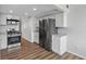Bright kitchen features stainless steel appliances, gray countertops, and wood-look flooring at 5095 Bay Ne St # 210, St Petersburg, FL 33703