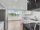 Modern kitchen features white cabinets and stainless steel appliances at 5095 Bay Ne St # 210, St Petersburg, FL 33703