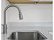 Close up of stainless steel kitchen sink and faucet featuring light countertops at 5095 Bay Ne St # 210, St Petersburg, FL 33703