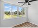 Living room with expansive windows offering a beautiful view of the community and blue skies at 5095 Bay Ne St # 210, St Petersburg, FL 33703