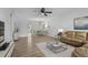 Bright living room showcasing a modern sofa, stylish decor, and an open dining area, creating an inviting space at 5095 Bay Ne St # 210, St Petersburg, FL 33703