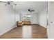 Well-lit living room featuring hardwood floors and comfortable seating at 5095 Bay Ne St # 210, St Petersburg, FL 33703
