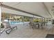 A covered patio seating area offers shade and poolside views for relaxation at 5095 Bay Ne St # 210, St Petersburg, FL 33703