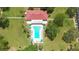 An aerial view of the community pool with seating and palm trees at 5095 Bay Ne St # 210, St Petersburg, FL 33703