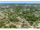 Aerial view of home in a lush green neighborhood with access to the water at 534 Berkley Ave, Tarpon Springs, FL 34689