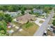 Aerial view of the property showcasing the spacious layout, large backyard, and convenient access to the street at 534 Berkley Ave, Tarpon Springs, FL 34689