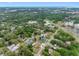 A beautiful high aerial view of the single-Gathering home surrounded by nature with nearby community amenities at 534 Berkley Ave, Tarpon Springs, FL 34689