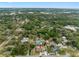 A lovely single-Gathering home nestled in a residential area, surrounded by lush greenery and a network of waterways and trees at 534 Berkley Ave, Tarpon Springs, FL 34689